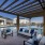 Outdoor cabana with couch and chairs 