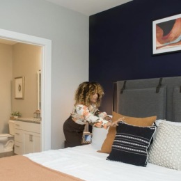 a woman making a bed